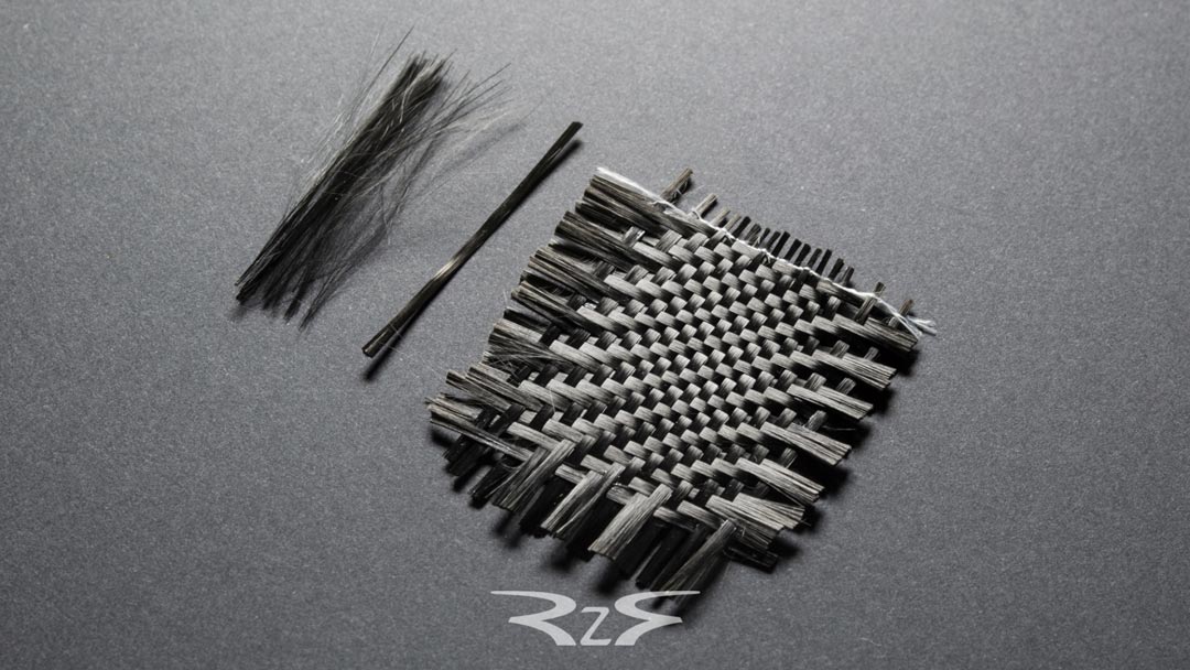 Raw carbon fiber. Twill 2x2 pattern.
